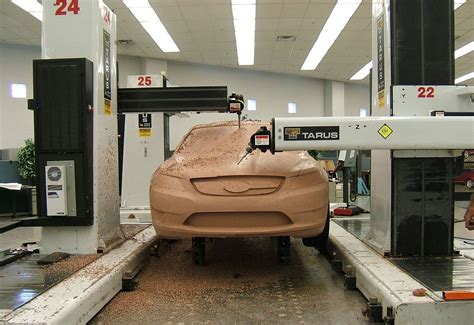using cnc machine to sculpt clay .